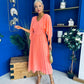 Jennifer Cape Detail Occasion Dress Peach
